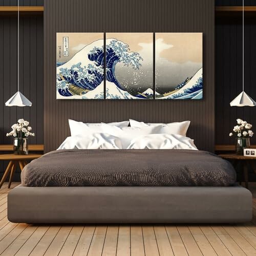 Bedroom with a large bed and wave artwork on the wall.