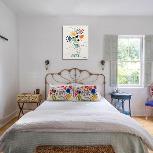 Cozy bedroom with floral decor and artwork above the bed.