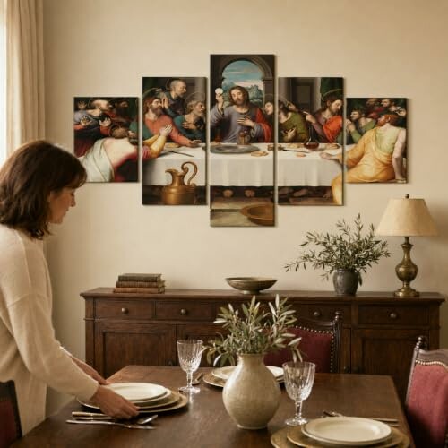 Woman setting table under multi-panel Last Supper artwork.