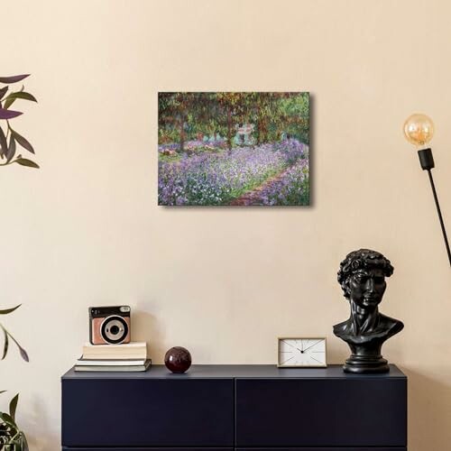 Stylish room with a painting, vintage camera, bust sculpture, and modern lamp.