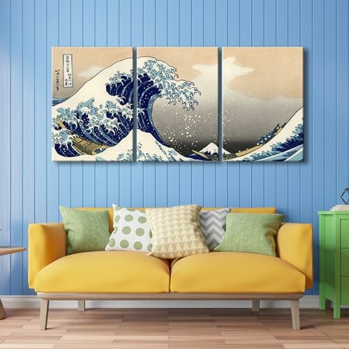 Room with a yellow couch, colorful pillows, and Great Wave wall art.