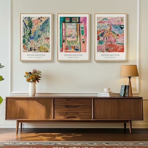 Living room with Matisse art prints and wooden sideboard.